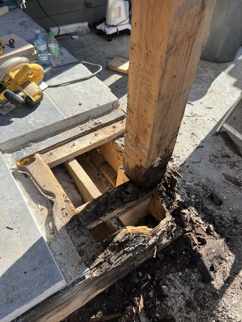 Post and framing repair in progress after rot removal